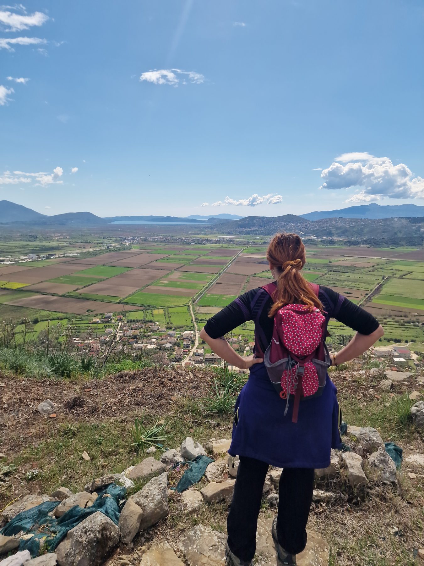 A hiker takes in the view over the Drinos plain