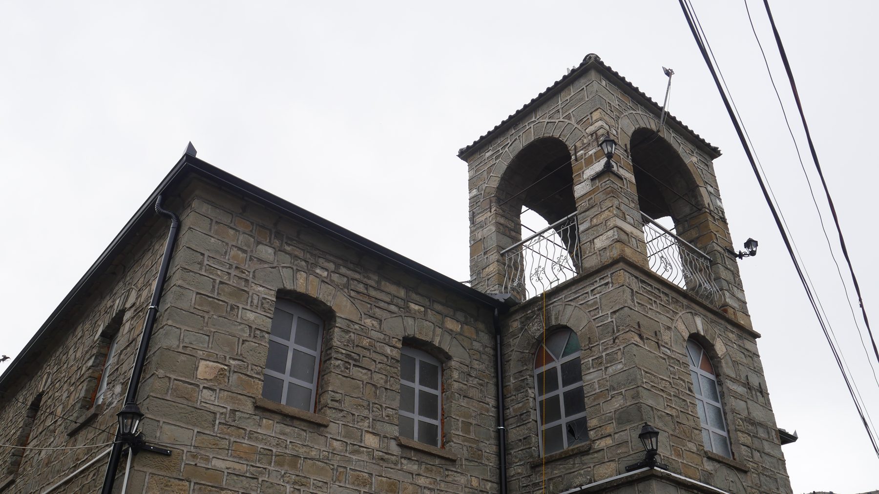 A stone church and bell tower