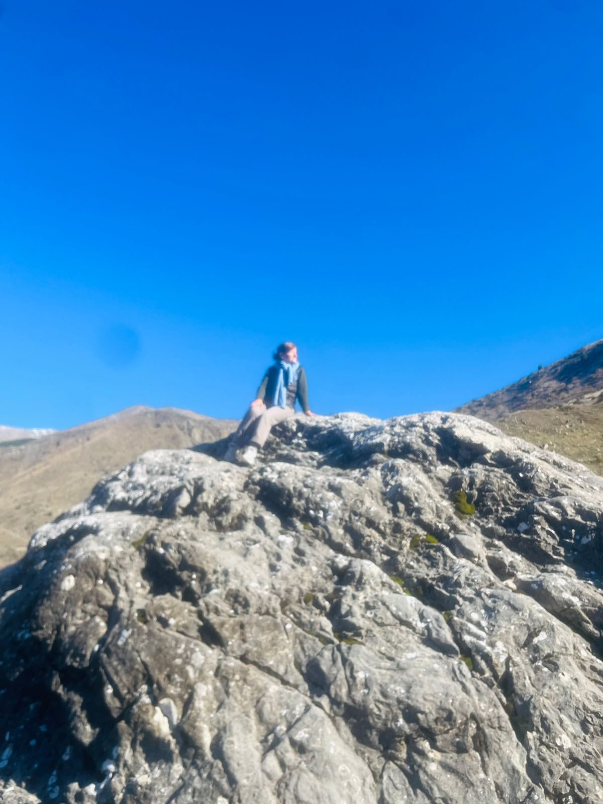 Resting on a rocky summit outcrop